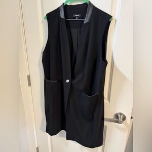 Long sleeveless blazer like new. Only worn once